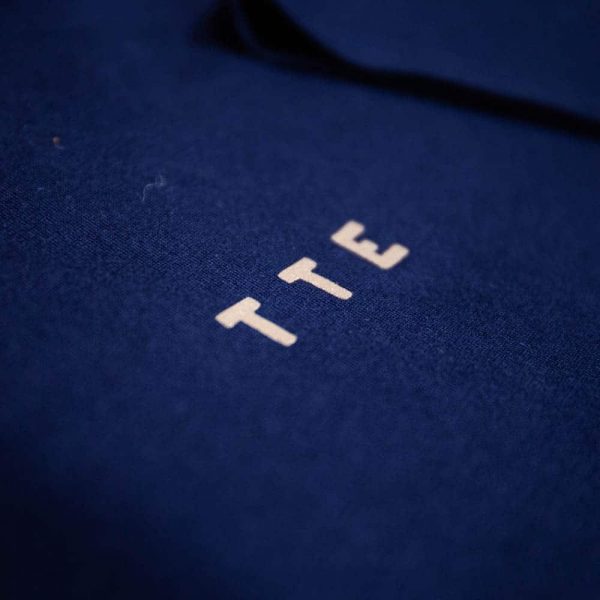 Embroidered TTE motif on blue